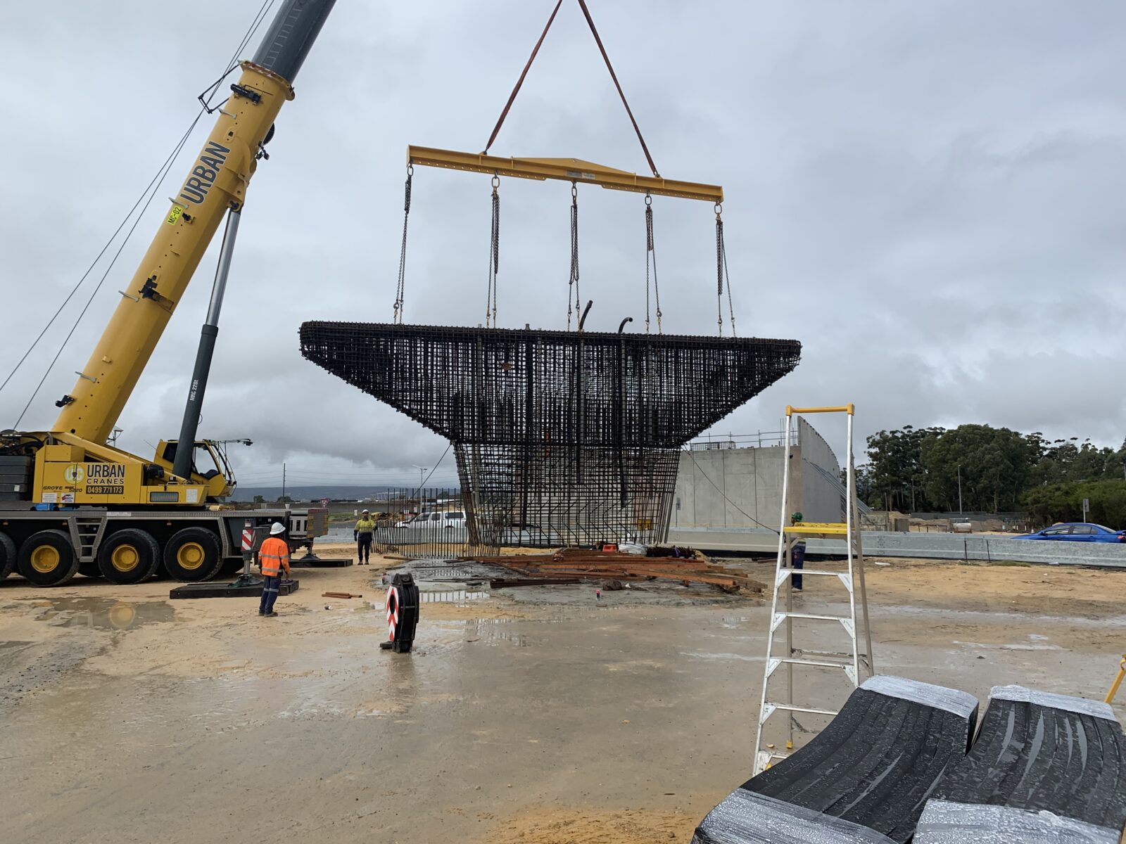 Pier cage being lifted by crane