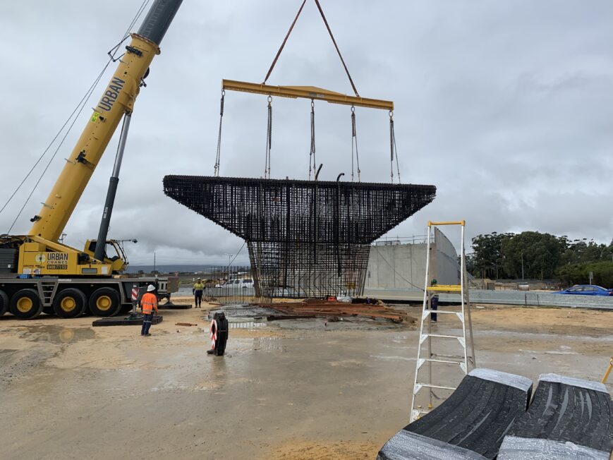 Pier cage being lifted by crane